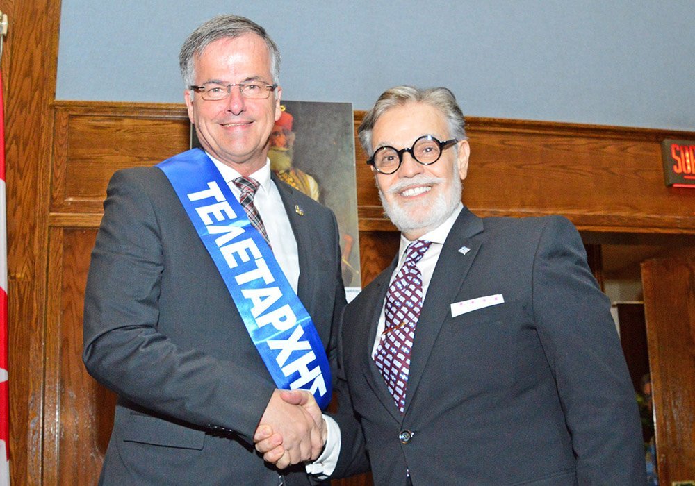 Chomedey Liberal MNA Guy Ouellette, left, is this year’s Greek Independence Day Parade Marshall. HCGM president Nicholas T. Pagonis on the right.