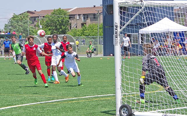 Photo: strikers for Team Quebec attempt to get one past the Ontario goalie.