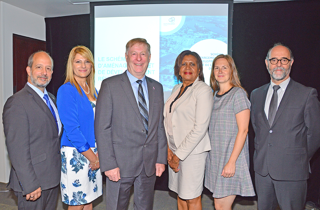 Mayor Marc Demers, centre, is seen with some of the officials who were instrumental in developing the new master urban plan. They are (from the left) Councillor Vasilios Karidogiannis, Councillor Aline Dib, Councillor Jocelyne Frédéric-Gauthier, Councillor Virginie Dufour and city manager Serge Lamontagne.